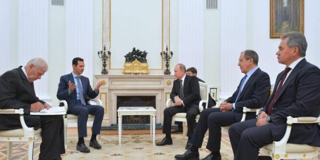 الرئيسان الروسي فلاديمير بوتين والسوري بشار الأسد في اجتماع سابق بينهما.