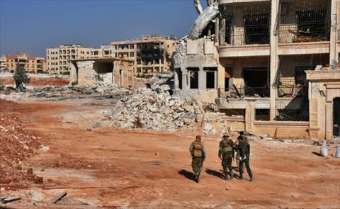 قوات حكومية سورية في حي منيان بغرب حلب. (فرتنس برس).