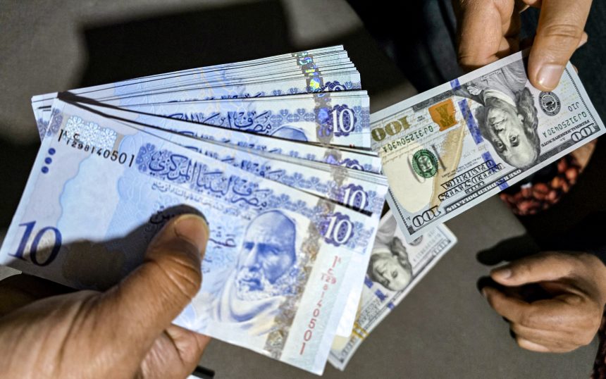 AFP 20250417 42M886D v1 HighRes LibyaEconomyForexCurrencyDinarDevaluation