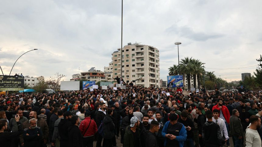 AFP 20251125 864D6AQ v1 HighRes SyriaConflictAlawiteProtest